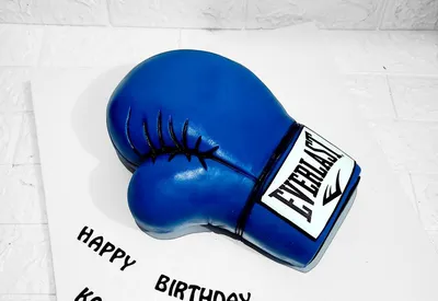 Blue boxing glove shaped novelty birthday cake